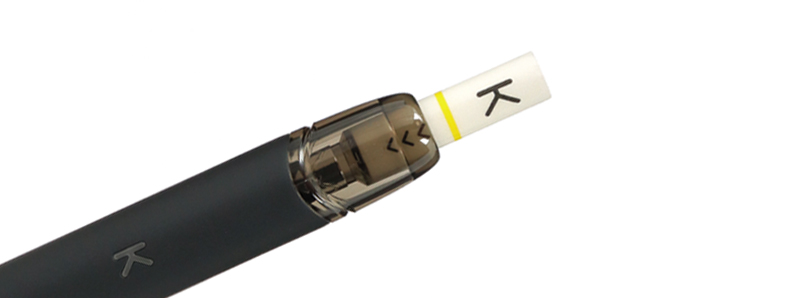 Kiwi Vapor's Kiwi cartridge with its cotton filter drip tip on the Kiwi Pen pod